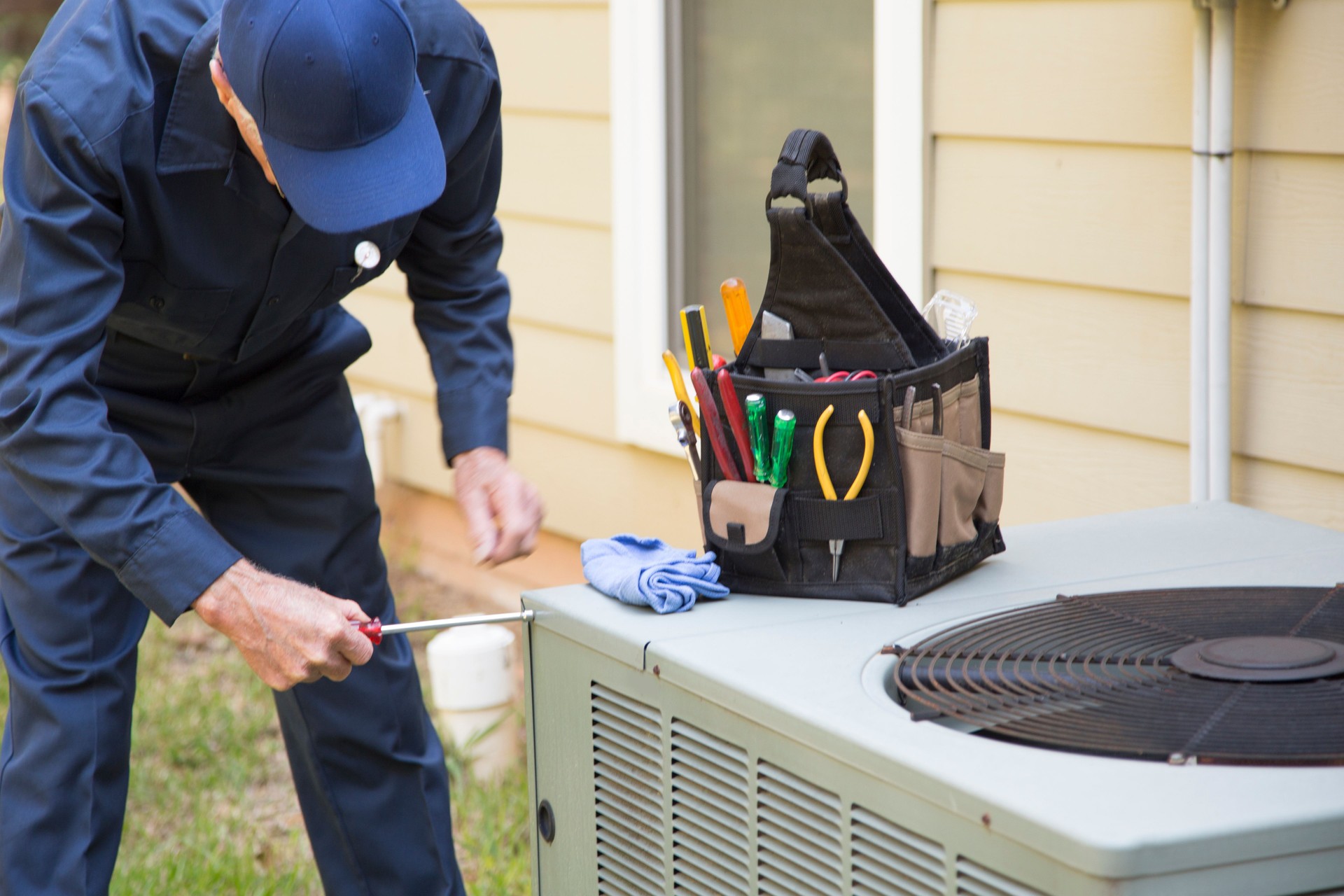 Technician services outside AC units and generator. Technician services outside AC units and generator.